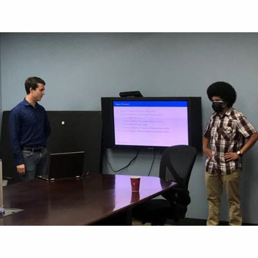 Denali Advisors interns present their research to the Denali team. Robert Snigaroff, standing on the left, is a sophomore at Columbia University studying mathematical economics. Noah Lightfoot, standing on right, is a junior at Stanford studying economics.